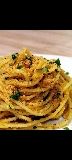 Spaghetti con taralli al pepe